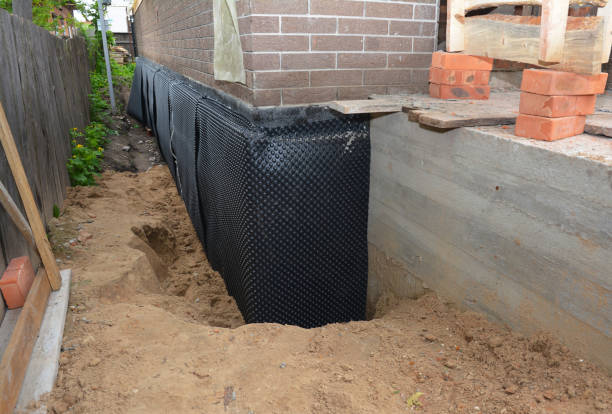 SJ Waterproofing Pros technician performing targeted Wet Basement Repair assessment in New Market, VA